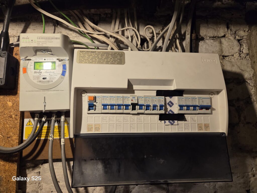 Failed EICR Remedial Works Wimbledon - Consumer Unit Inspection Failed EICR remedial works in Wimbledon showing consumer unit, smart meter and electrical installation inspected by BuildSpark electrician