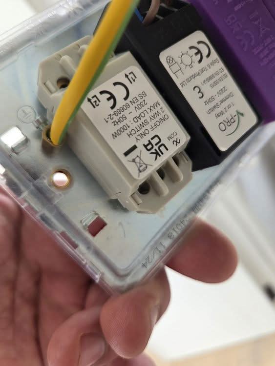 Dimmer Module Replacement Morden Replacing a faulty dimmer module during electrical repairs in Morden by BuildSpark