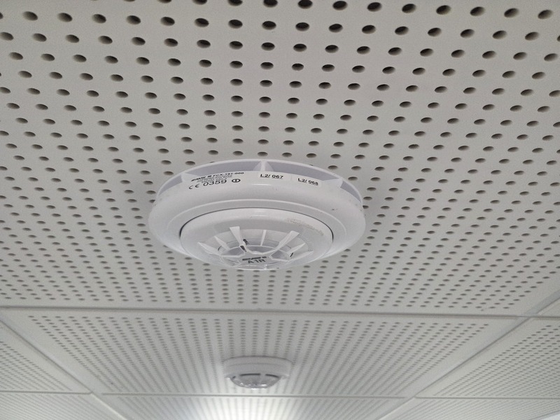 Grade A Commercial Fire Alarm Detector Installation BS 5839-1 Grade A commercial optical smoke detector installed on ceiling in South West London